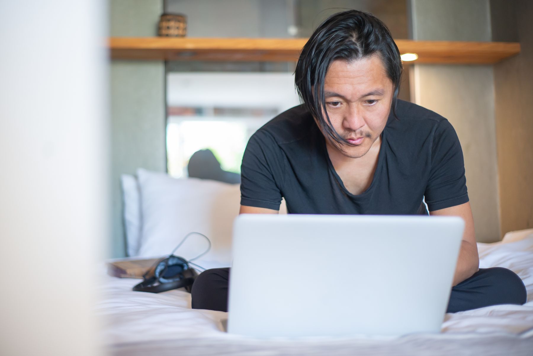 A man working through the course on a laptop at home.